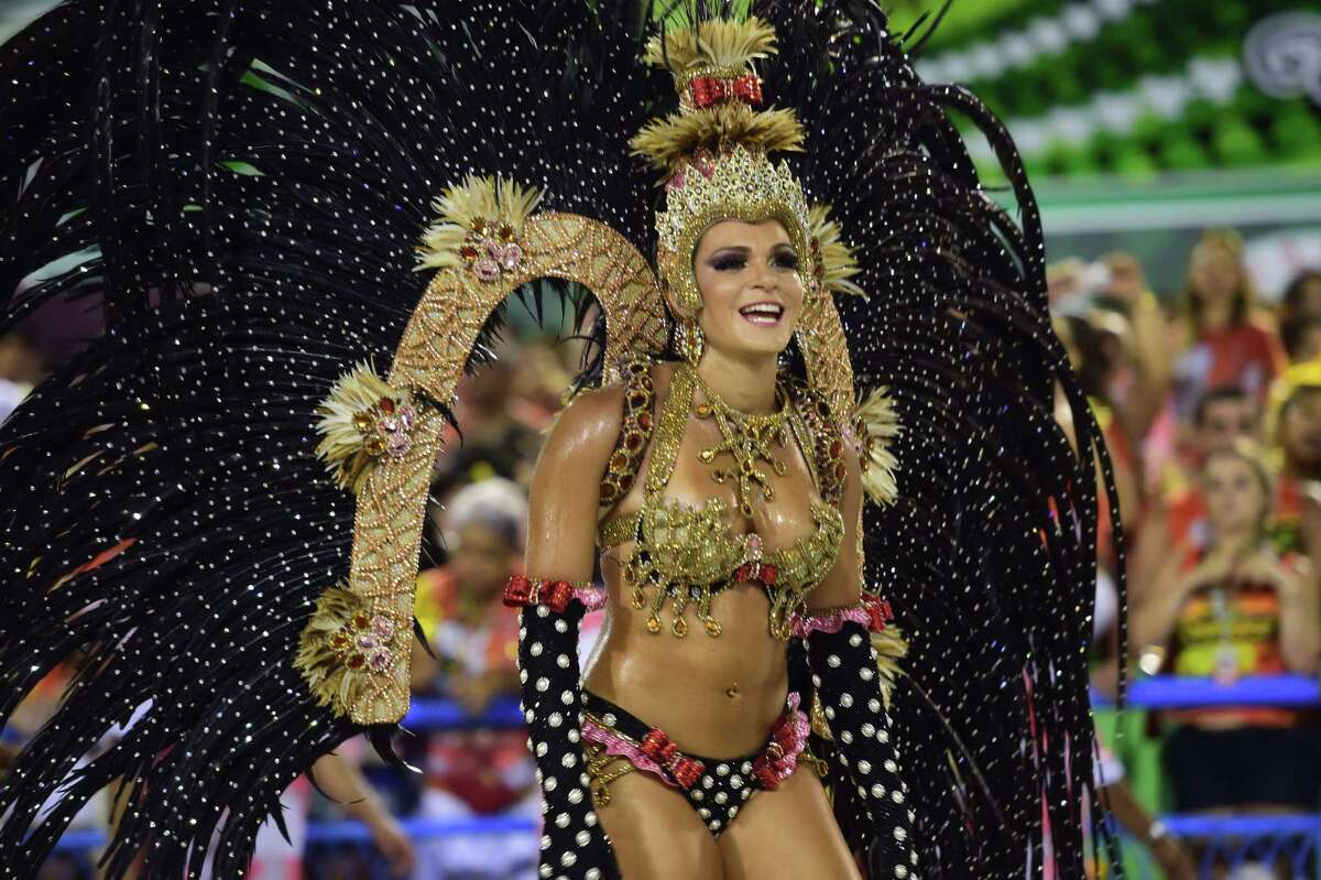 Revelers of the Salgueiro samba school perform during the first day of carnival parade at the Sambodrome in Rio de Janeiro, Brazil on Feb. 16, 2015.