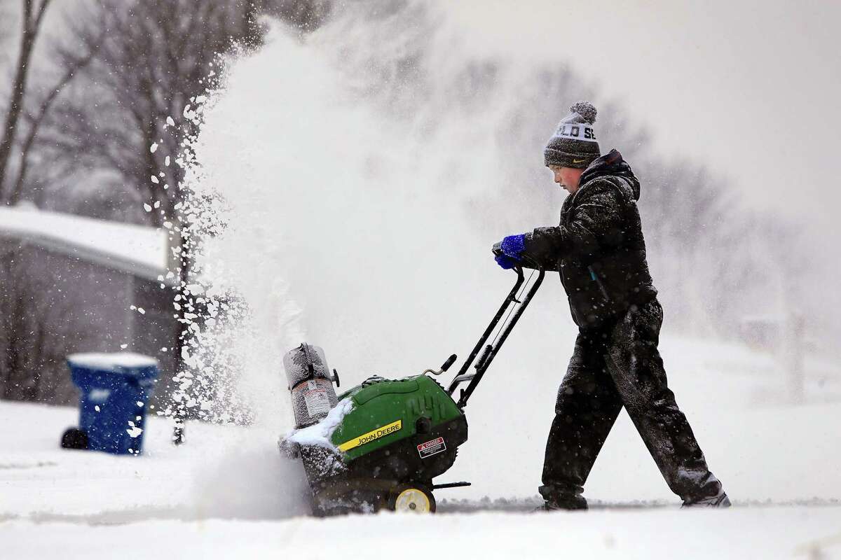 Connor Williams, 11, operates a snowblower for the first time on Monday, Feb. 16, 2015, as he helps his grandmother, Linda Wililams, clear her driveway in Maryland Heights, Mo. "He'll spray you if you're not carefull," said Linda Williams. (Christian Gooden/St. Louis Post-Dispatch/TNS)