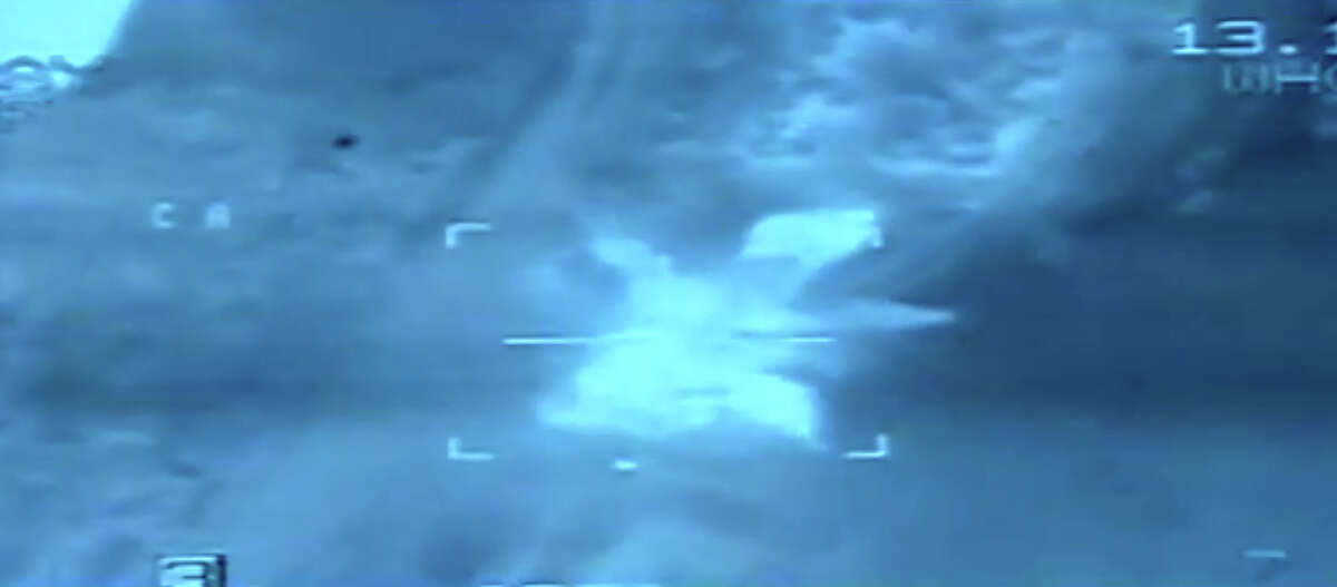 This video image from aerial footage released by the Egyptian Defense Ministry, shows an airstrike on Islamic State group positions, in Libya, Monday, Feb. 16, 2015. Egyptian warplanes struck Islamic State targets in Libya in swift retribution for the extremists' beheading of a group of Egyptian Christian hostages on a beach, shown in a grisly online video released hours earlier. (AP Photo/Egyptian Defense Ministry)