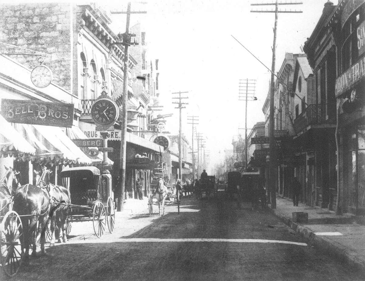 The Hertzberg Clock can be seen in this view of Commerce Street, east from the Kampmann Building, in a photo taken sometime before 1910.