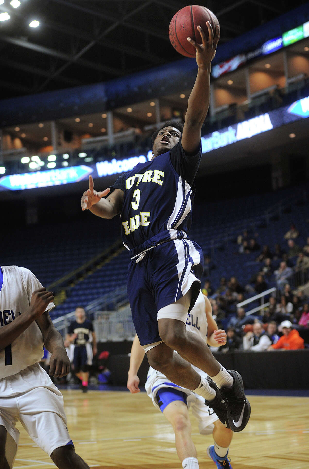 Notre Dame of Fairfield's Clinton Davidson drives to the basket during the fourth quarter of their victory over Bunnell at the Webster Bank Arena in Bridgeport, Conn. on Monday, February 16, 2015.