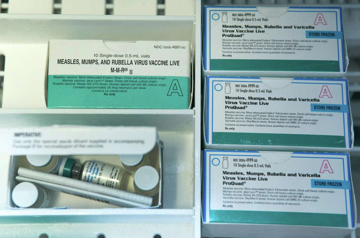 This Thursday, Jan. 29, 2015, file photo, shows boxes of the measles, mumps and rubella virus vaccine (MMR) and measles, mumps, rubella and varicella vaccine inside a freezer at a doctor's office.