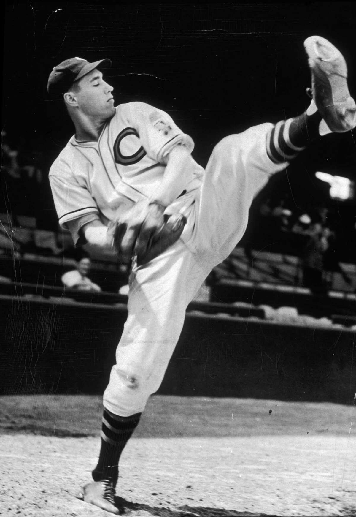 circa 1940: Full-length image of baseball pitcher Bob Feller of the Cleveland Indians winding up for a pitch during practice. (Photo by New York Times Co./Getty Images)