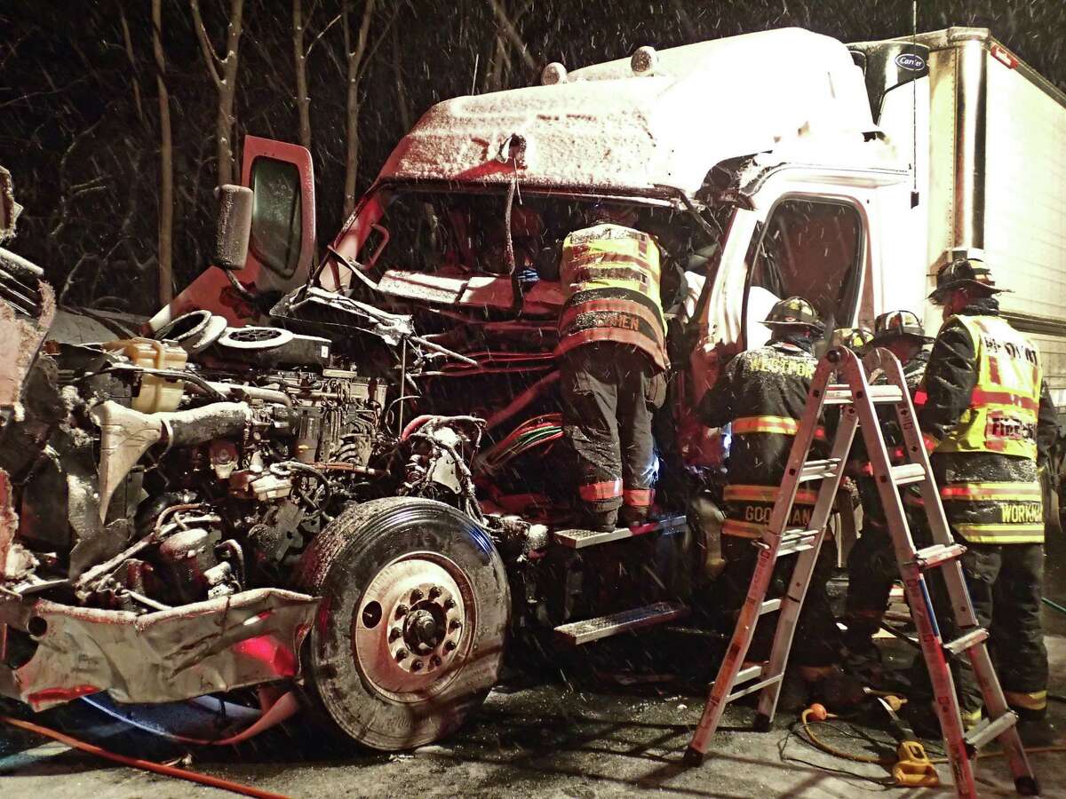 The Westport Fire Department responded to a tractor trailer accident on I-95 North between Exit 18 and 19 in Westport, Conn. at 5 a.m. Tuesday, Feb. 17, 2015. The driver had to be extricated from the truck's cab. The scene was cleared just as the snowy morning rush hour was getting under way.