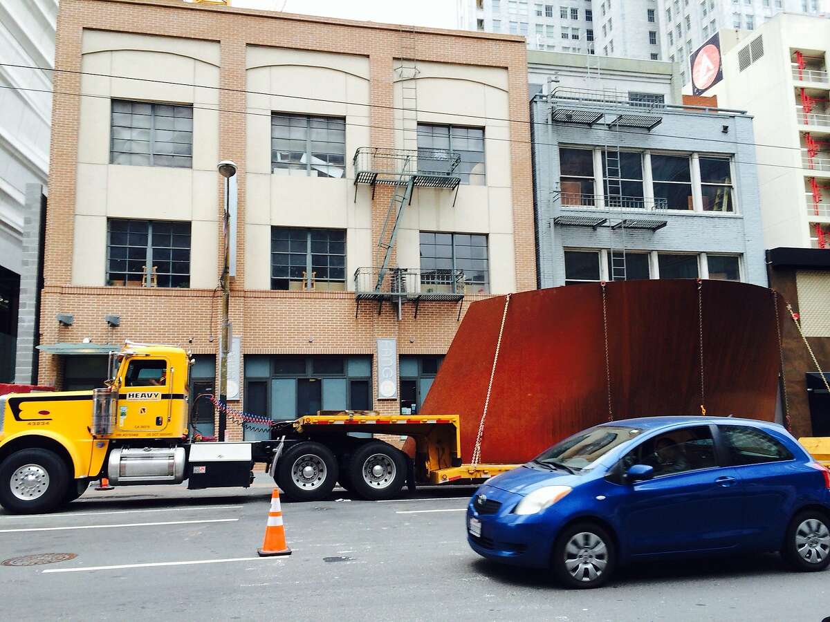 A section of Richard Serra's giant steel sculpture awaits unloading for exhibition at San Francisco's newly renovated Modern Museum of Art.