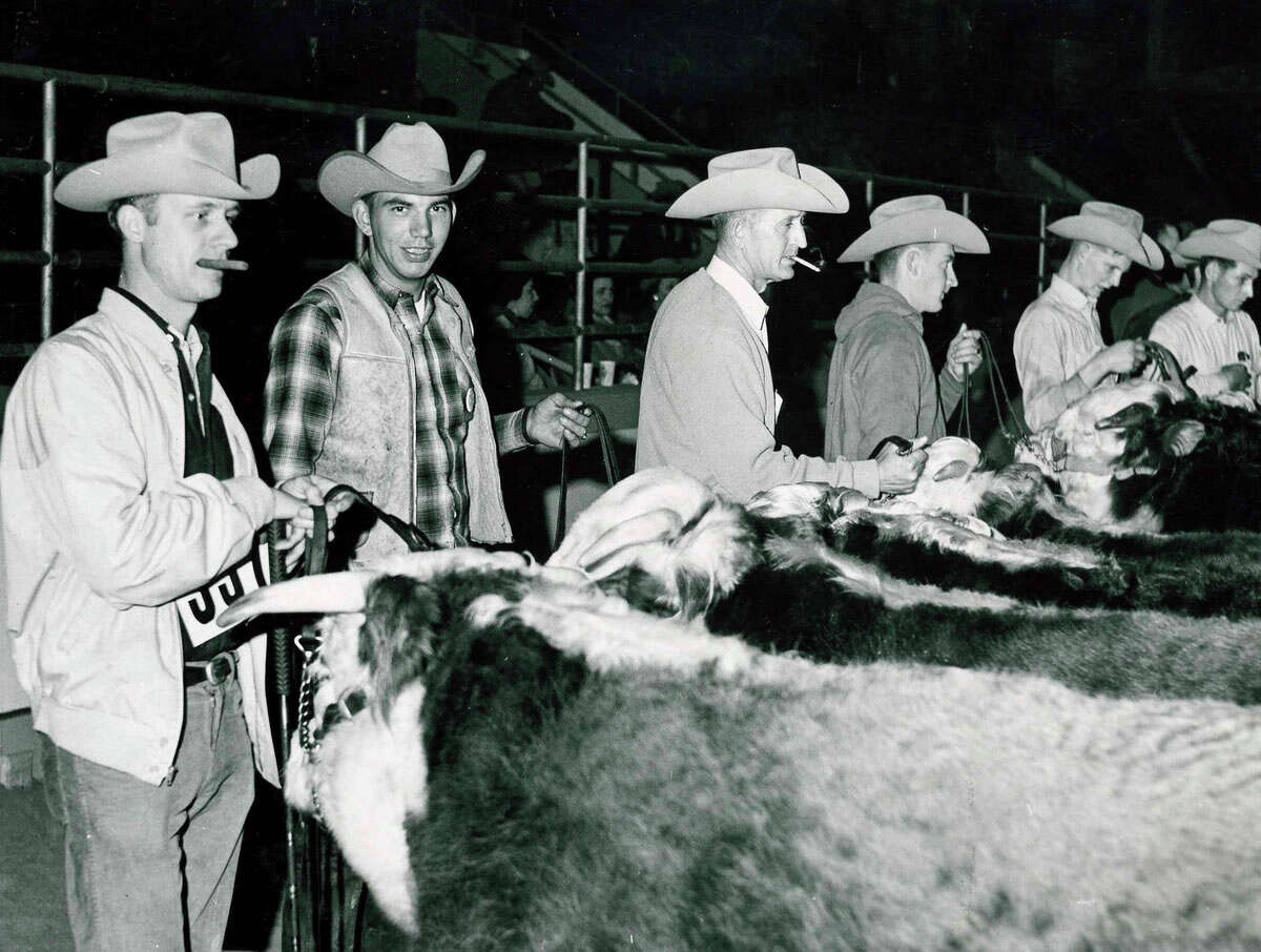 Professional Hereford judges and showmen gather at the 1965 Houston Livestock Show and Rodeo.