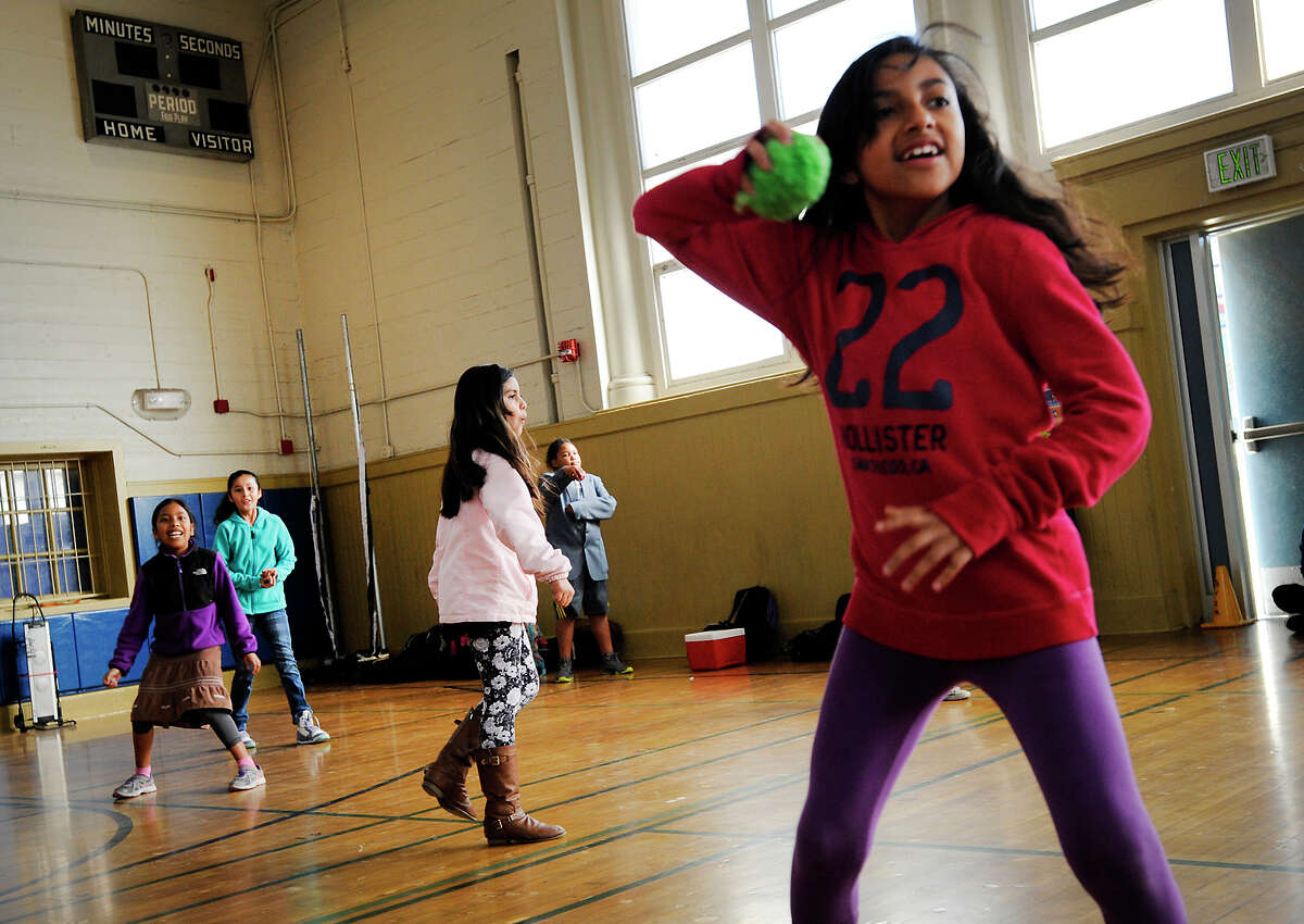Students in Frank Lara’s fourth grade at San Francisco’s Buena Vista Horace Mann school, including Valerie Pacheco (right), play during gym. A lawsuit charged the district with falling short on P.E. hours.