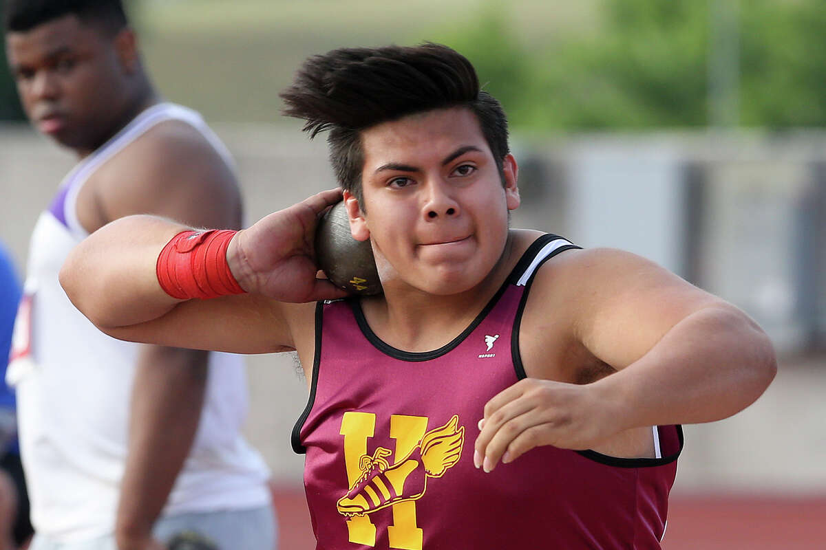 Harlandale’s Andres Garcia wiinds up for a throw in the 4A shot put during the UIL state track meet at Myers Stadium in Austin on May 9, 2014.