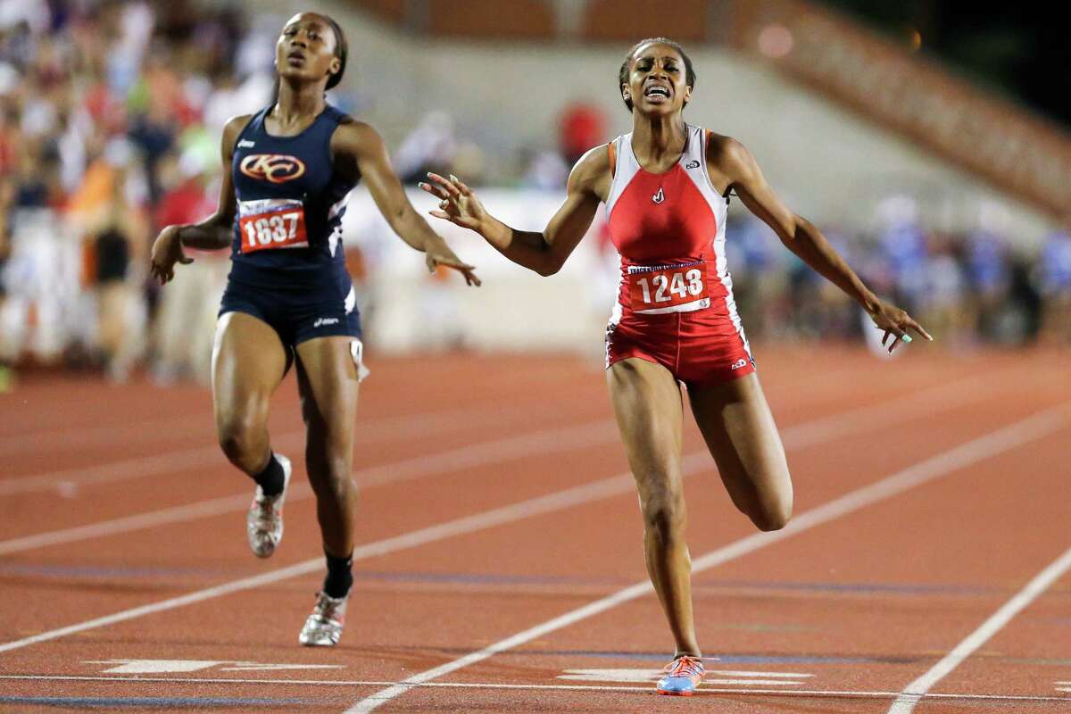 Judson’s Kiana Horton (right) crosses the finish line ahead of Klein Collins’ in the 5A 200-meter run during the UIL State track meet at Mike Myers Stadium in Austin on May 10, 2014. Horton finished second in the event with a time of 23.81 seconds.
