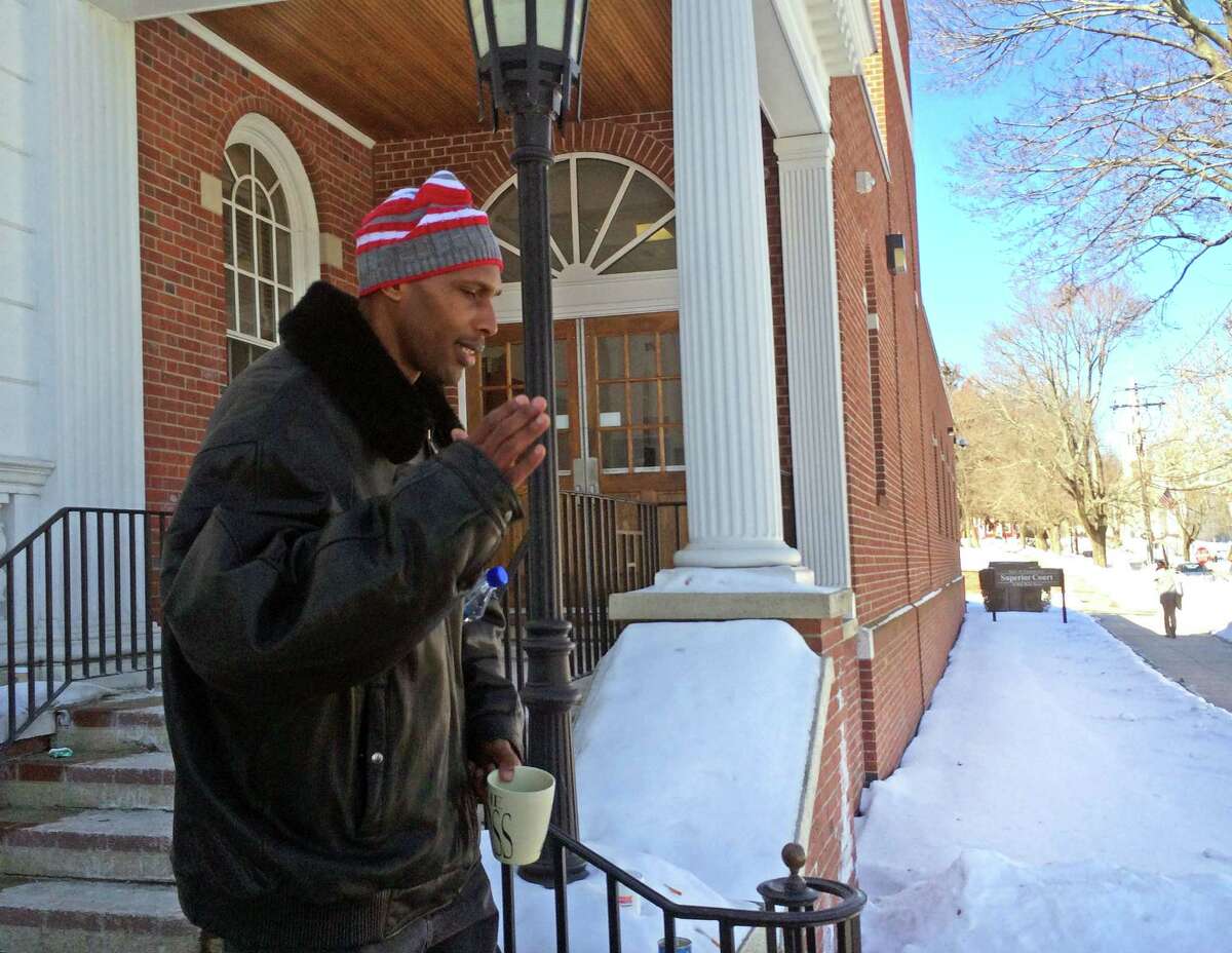 Anthony Pugh leaves Milford Superior Court after testifying in the murder trail of his cousin, Matthew Pugh on Wednesday, Feb. 18, 2015.