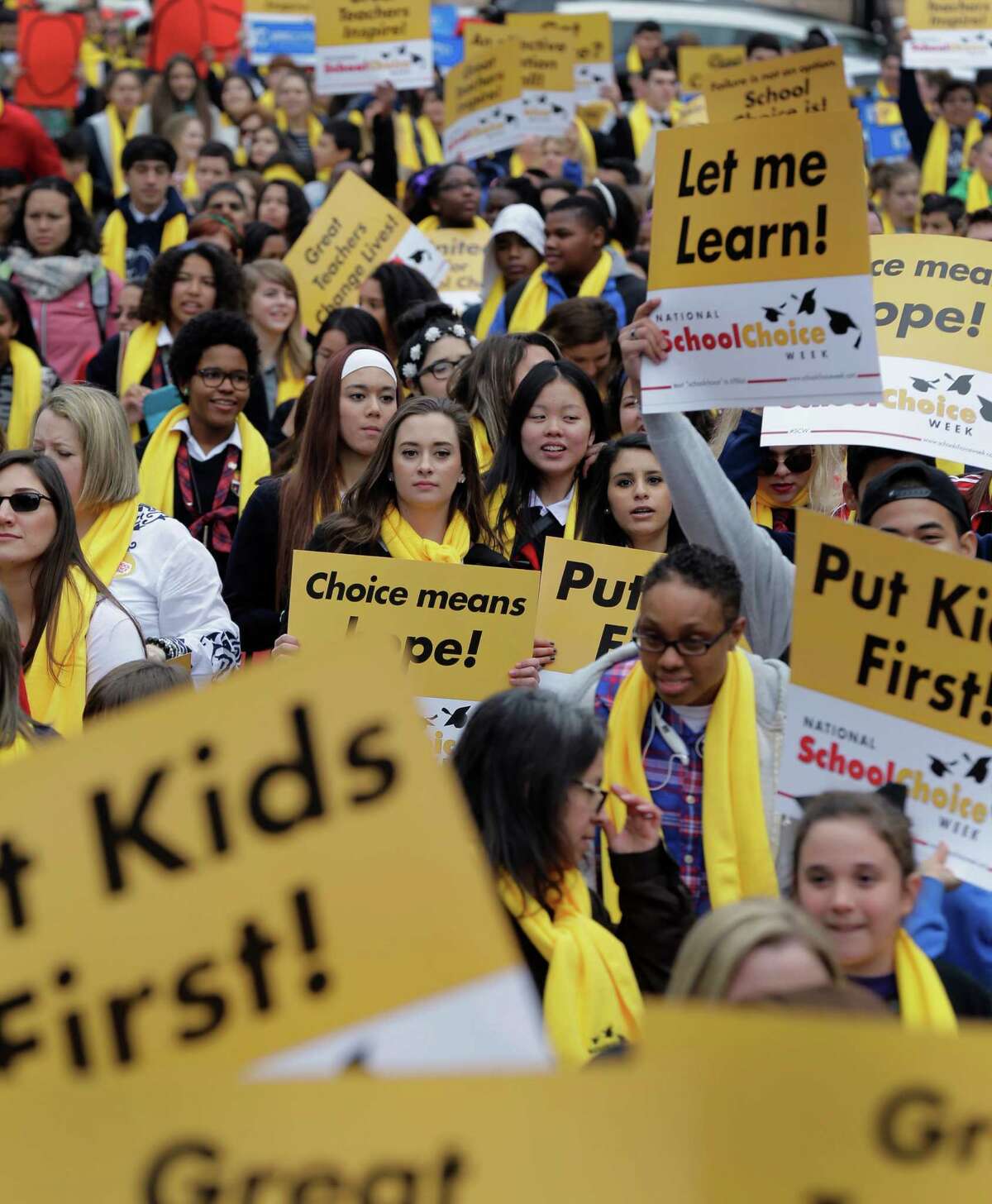 School choice supporters march on the grounds of the Texas Capitol last month in Austin.﻿