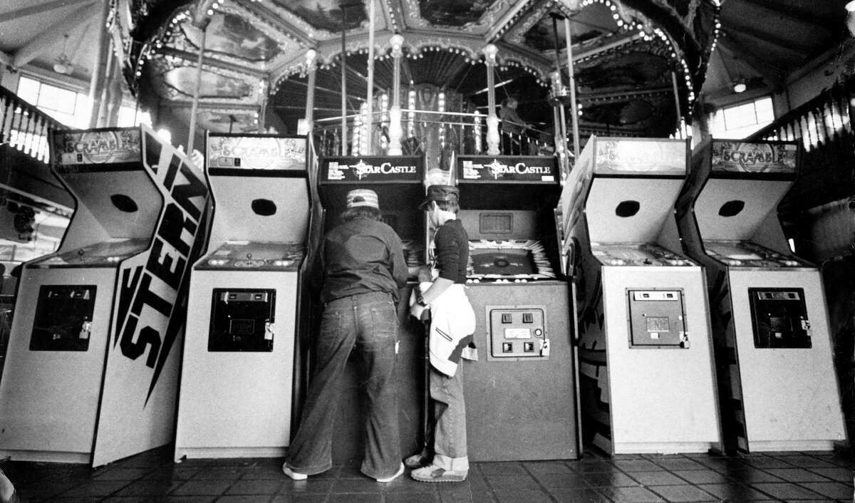 Kids play at the arcade at Pier 39 on Aug. 3, 1982.