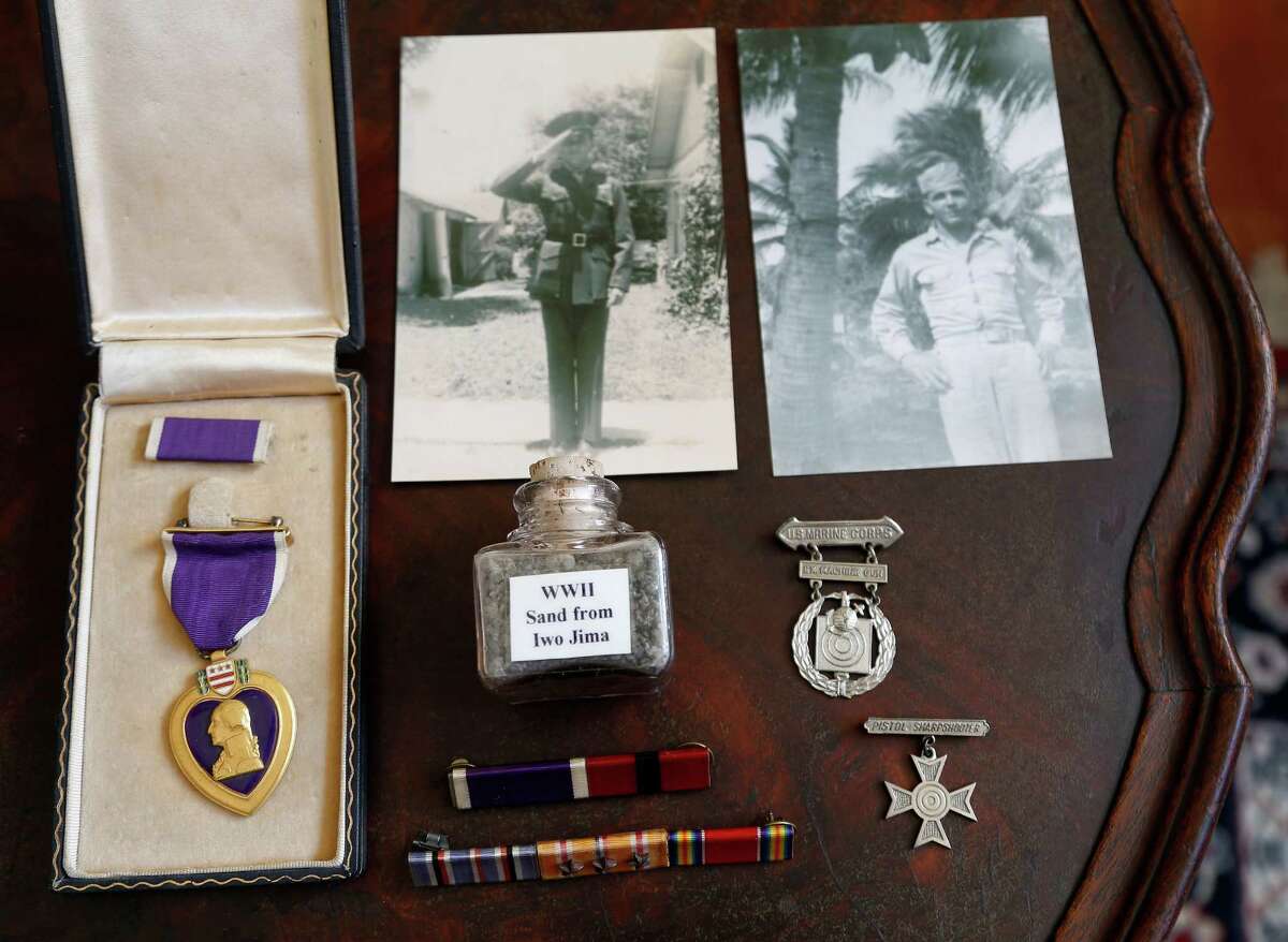 A Purple Heart and other items collected by Bill Sherrill, whose combat career was cut short by a Japanese rifleman's bullet on Iwo Jima in 1945.