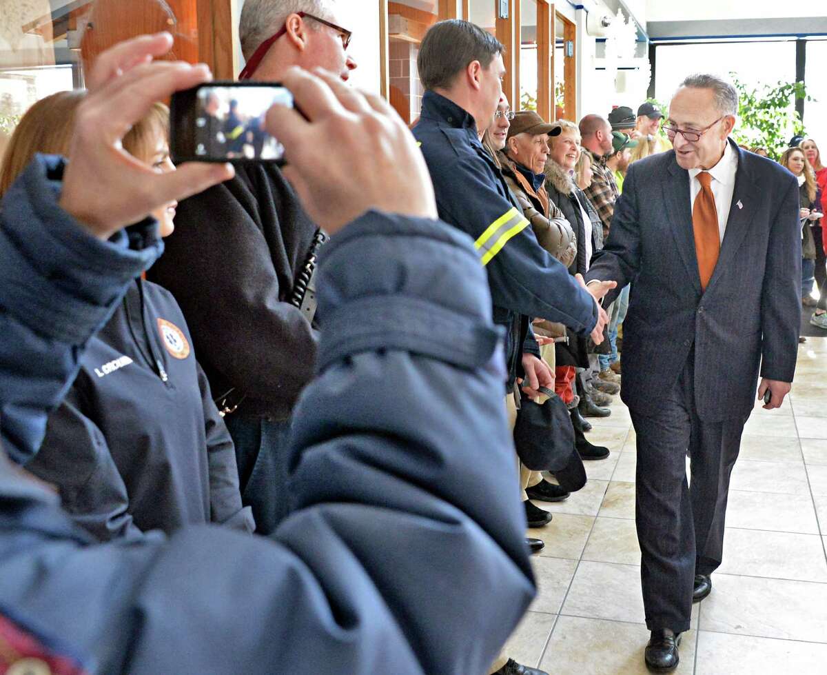 U.S. Senator Charles Schumer, greets town residents as he arrives to announce the push to secure a zip code for Halfmoon is announced at Halfmoon Town Hall Wednesday, Feb. 18, 2015, in Halfmoon, NY. The Town of Halfmoon is currently is split among four different towns' zip codes. (John Carl D'Annibale / Times Union)