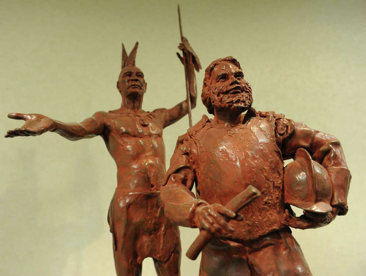 A bronze sculpture depicts Mayn Mayano, Chief of the Siwanoy tribe, and Captain Daniel Patrick of the Massachusetts Militia, transferring the deed for the patch of land that became Greenwich on the second floor of Town Hall in Greenwich, Conn. Thursday, Feb. 19, 2015. Captain Patrick and Robert Feake paid 25 English-colored coats for the the piece of land between Asamuck Brook and Potamuck Brook stretching inland in a northerly direction for an indefinite distance.
