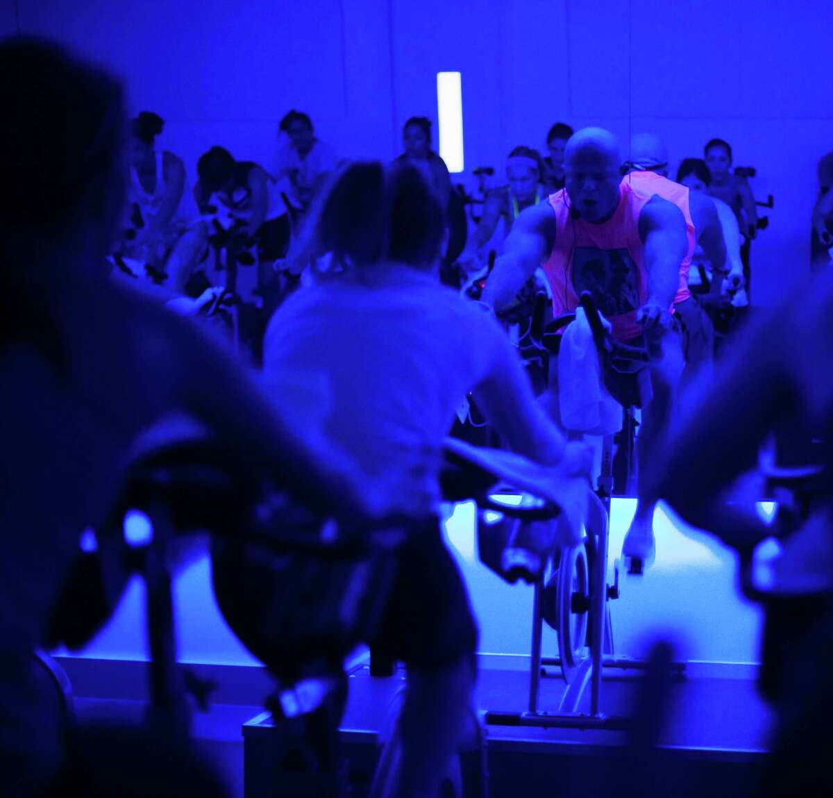 Will Longoria, an instructor at RIDE, leads a Rihanna and Justin Timberlake themed indoor cycling excercise class at RIDE Indoor Cylcing Studio in the Heights