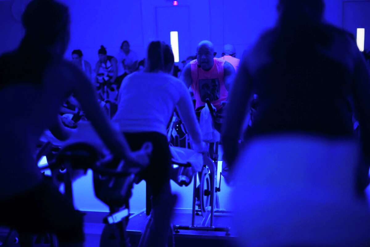 Will Longoria, an instructor at RIDE, leads a Rihanna and Justin Timberlake themed indoor cycling excercise class in the Heights Tuesday February 10, 2015. (Michael Starghill, Jr.)