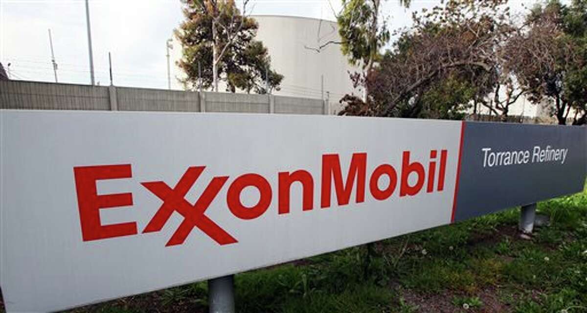 FILE - This Jan. 30, 2012, file photo, shows the sign for the ExxonMobil Torerance Refinery in Torrance, Calif. Exxon Mobile on Monday, Feb. 2, 2015, reported fourth-quarter earnings of $6.57 billion. (AP Photo/Reed Saxon, File)
