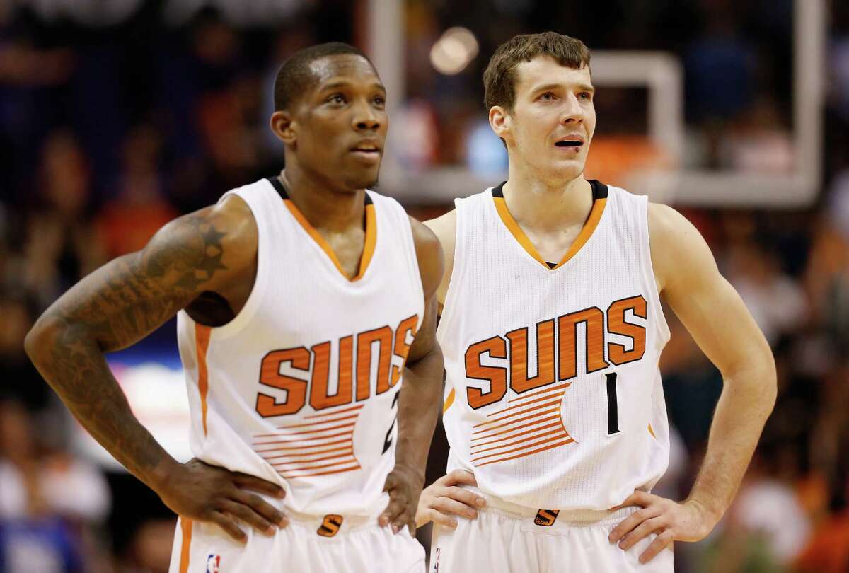 PHOENIX, AZ - JANUARY 21: (R-L) Goran Dragic #1, and Eric Bledsoe #2 of the Phoenix Suns look on during a break from the NBA game against the Portland Trail Blazers at US Airways Center on January 21, 2015 in Phoenix, Arizona. The Suns defeated the Trail Blazers 118-113. NOTE TO USER: User expressly acknowledges and agrees that, by downloading and or using this photograph, User is consenting to the terms and conditions of the Getty Images License Agreement. (Photo by Christian Petersen/Getty Images)