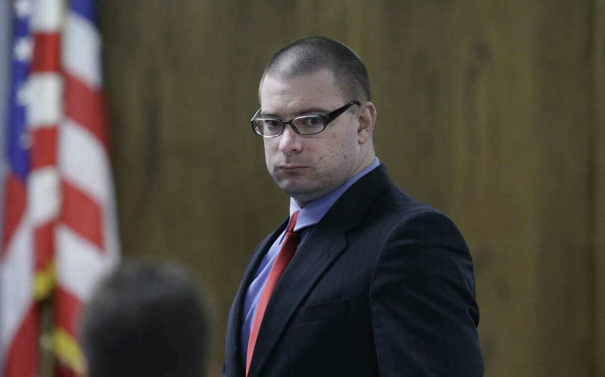 Left: Former Marine Cpl. Eddie Ray Routh enters the court after a break during his capital murder trial at the Erath County, Donald R. Jones Justice Center Thursday, Feb. 19, 2015, in Stephenville, Texas. Routh is charged with the 2013 deaths of former Navy SEAL Chris Kyle and his friend Chad Littlefield at a shooting range near Glen Rose, Texas. (AP Photo/LM Otero,Pool)
