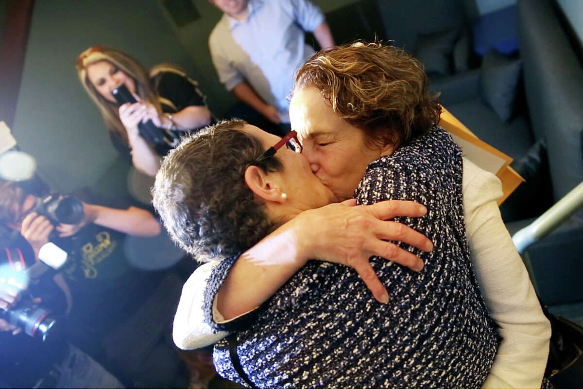 Sarah Goodfriend and Suzanne Bryant kiss at a reception in Austin following their marriage earlier that morning Thursday Feb. 19, 2015. Goodfriend and Bryant are the first legally wed gay couple in Texas. (AP Photo/The Daily Texan, Shelby Tauber)