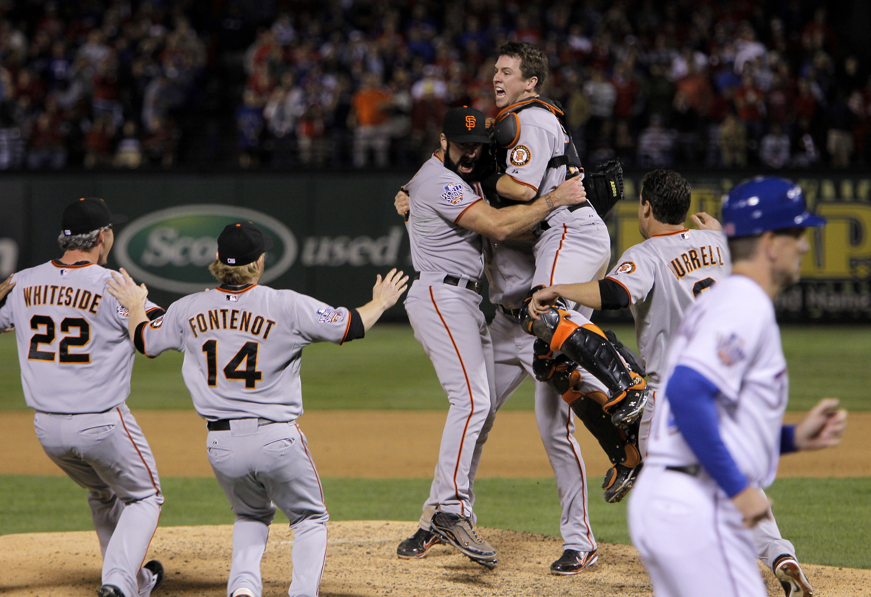 San Francisco Giants pitcher and World Series MVP Madison Bumgarner (R)  hugs his catcher Buster Posey after the final out in game 7 of the World  Series at Kauffman Stadium in Kansas