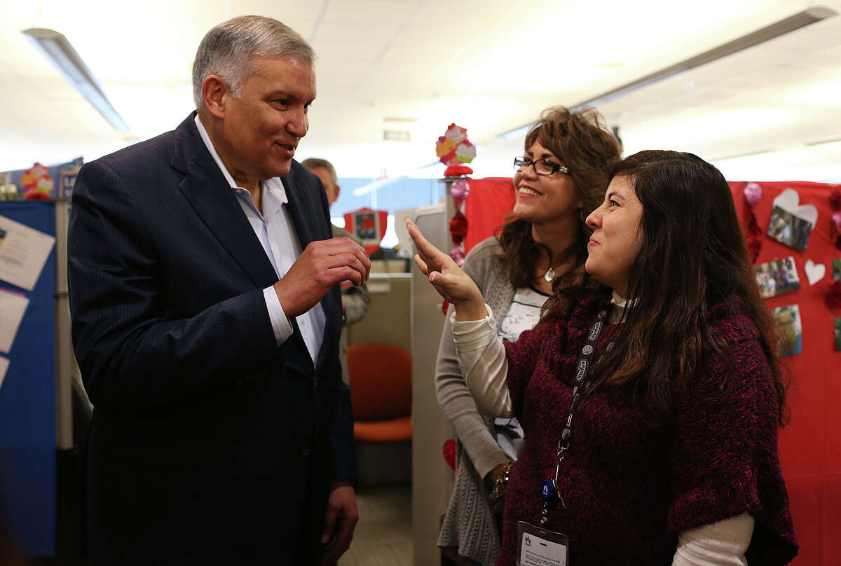 USAA CEO and President Robles talks with Sylvia Webber (center) and Veronica G. Rodriguez. Robles was at the bank to bid farewell to the employees.