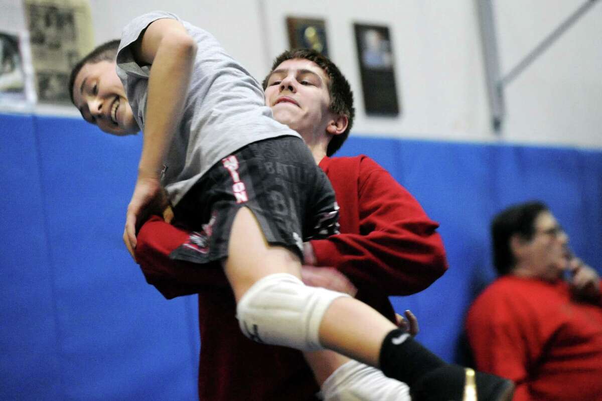 LaSalle's Trent Nadeau, center, lifts Columbia's Michael Gonyea during wrestling practice on Friday, Feb. 20, 2015, at Columbia High in East Greenbush, N.Y. (Cindy Schultz / Times Union)