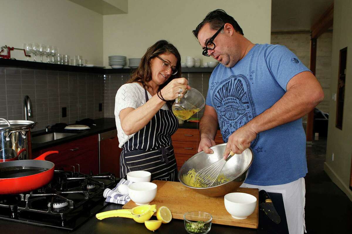 Chefs Dona Savitsky and Thomas Schnetz, who opened Doña Tomás in Oakland 15 years ago, make aioli in their kitchen at home in Oakland.