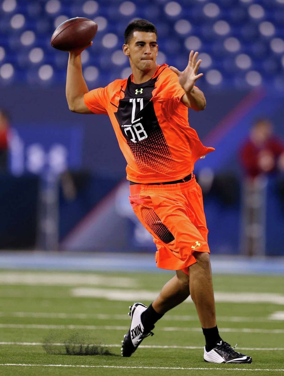 Florida State's Jameis Winston, left, and Oregon's Marcus Mariota displayed their quarterbacking talents at the NFL scouting combine on Saturday, with Winston completing all 16 of his attempts and Mariota going 13-of-15.