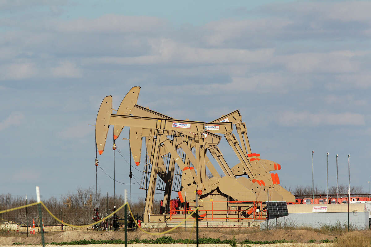 Pump jacks extract oil and gas from the Eagle Ford Shale at a pad off Texas 72 east of Tilden. On Thursday, U.S. benchmark West Texas Intermediate crude oil fell as low as $45.23 per barrel during the trading day before closing down 26 cents at $46.38.