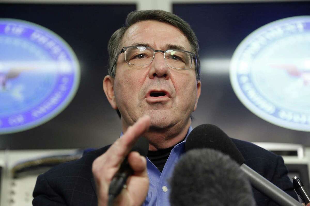 U.S. Secretary of Defense Ashton Carter speaks on board his plane en route to Afghanistan Friday, Feb. 20, 2015. Carter made his international debut Saturday with a visit to Afghanistan to see American troops and commanders, meet with Afghan leaders and assess whether U.S. withdrawal plans are too risky to Afghan security. (AP Photo/Jonathan Ernst, Pool)