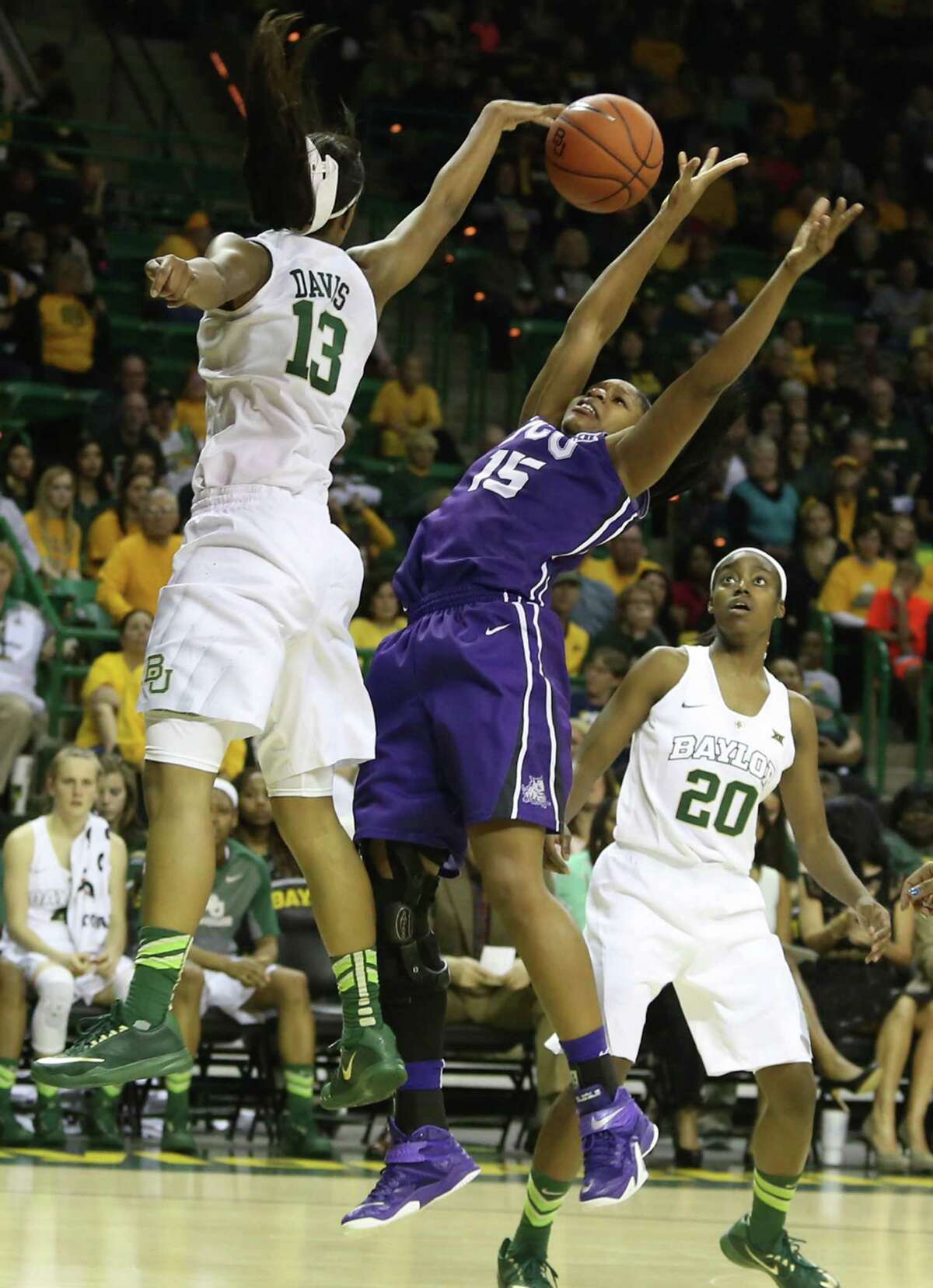 Baylor's Nina Davis (13) blocks the shot of TCU's Jada Butts in the first half - one of nine blocked shots by the No. 3 Lady Bears in their 91-75 victory.