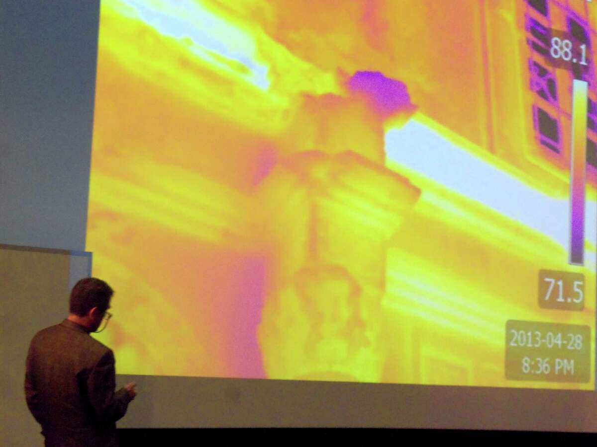Structural engineer Patrick Sparks discusses his work on the Alamo, showing an infrared image of the church facade at the history symposium held by Texas A&M University's Center for Heritage Conservation in College Station.