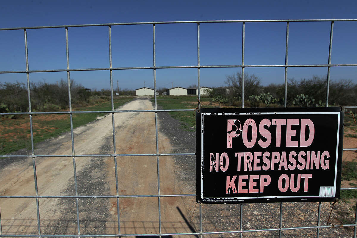 A welded-steel fence blocks the entrance to a closed man-camp in the 80-acre tract called Rancho Agave in Carrizo Springs, Texas, Wednesday, February 11, 2015. A drop in the price of crude oil has led to lower prices at the pump for consumers. The price went from a high of over $100 to around $50 per barrel of oil. The lower price has led to a decrease in activity in play area. The reason for the closure of the camp was not known.