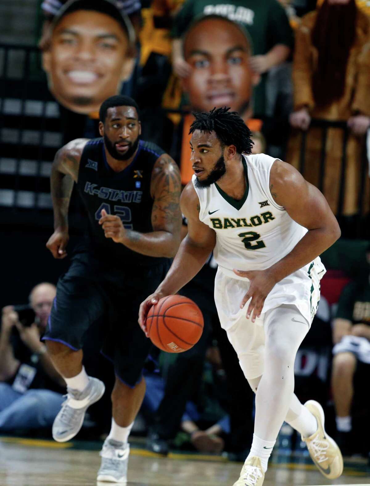 Baylor forward Rico Gathers (2), right, drives up court on Kansas State forward Thomas Gipson (42), left, in the second half of an NCAA college basketball game, Saturday, Feb. 21, 2015, in Waco, Texas. Baylor won 69-42. (AP Photo/Rod Aydelotte)