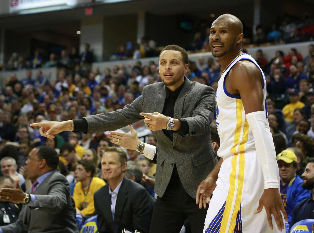 Golden State Warriors guards Stephen Curry, left, and Leandro Barbosa question a call from the bench in the second half of an NBA basketball game against the Indiana Pacers, Sunday, Feb. 22, 2015, in Indianapolis. Indiana won 104-98. (AP Photo/R Brent Smith)