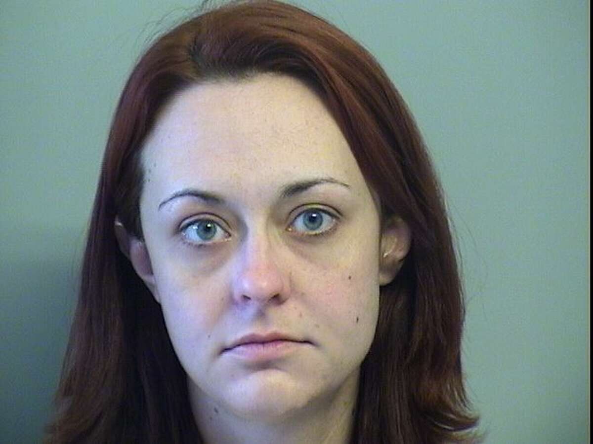 Amber Ellis was arrested for allegedly biting her boyfriend's penis and hitting him with a laptop.