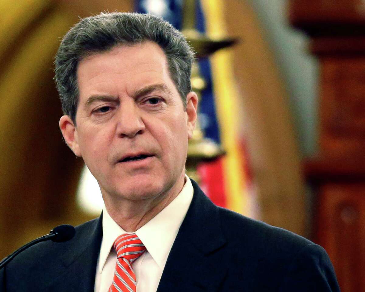 FILE - In this Jan. 15, 2015 file photo, Kansas Gov. Sam Brownback speaks at the Kansas Statehouse in Topeka, Kan. The Republican governor announced Tuesday, Feb. 10, 2015 that he issued an executive order rescinding a former governorÂ?’s order barring discrimination against gays and lesbians in hiring and employment throughout much of state government. (AP Photo/Orlin Wagner, File)