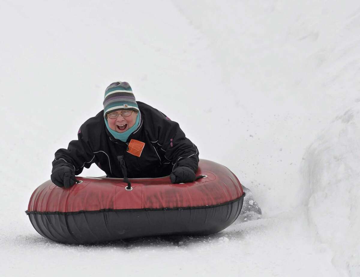 Snow tubers enjoy the ride at Woodbury