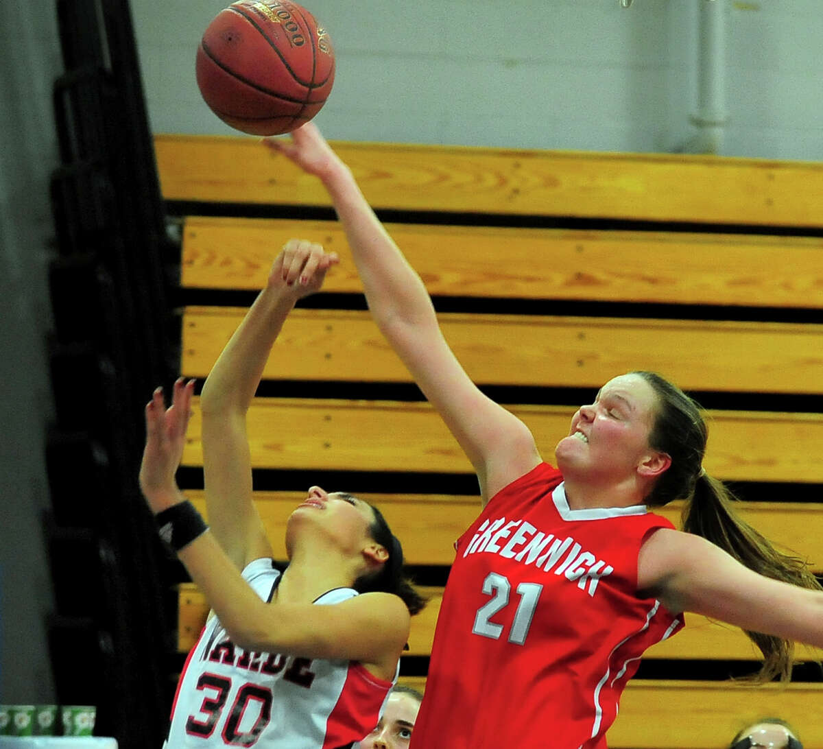 reenwich's Abigail Wolf, right, blocks a shot by Fairfield Warde's Sarah Cotto, during FCIAC Girls' Basketball Semi-finals action in Fairfield, Conn. on Tuesday Feb. 24, 2015.