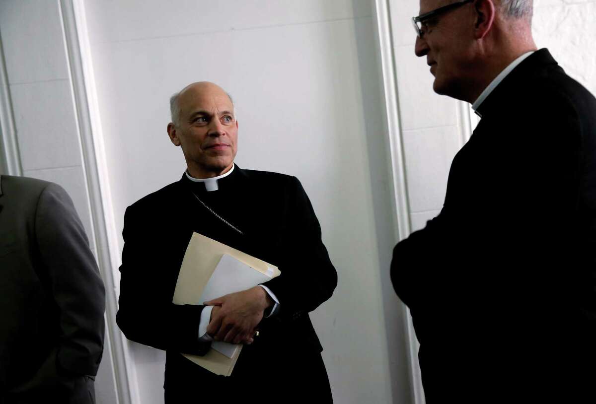 San Francisco Archbishop Salvatore Cordileone, (left) is joined by Vicar for Administration, Father John J. Piderit as they arrive for a meeting with the Chronicle's editorial board on Tues. February 24, 2015. Cordileone is a leading conservative "culture warrior" among the nation's Catholic Church leaders.