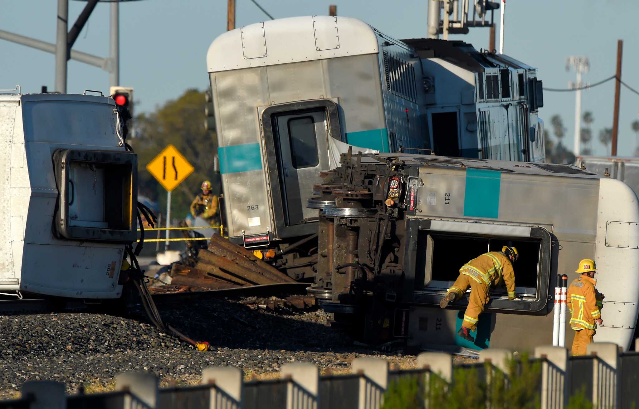 Truck stalls on track before fiery train crash, 28 injured