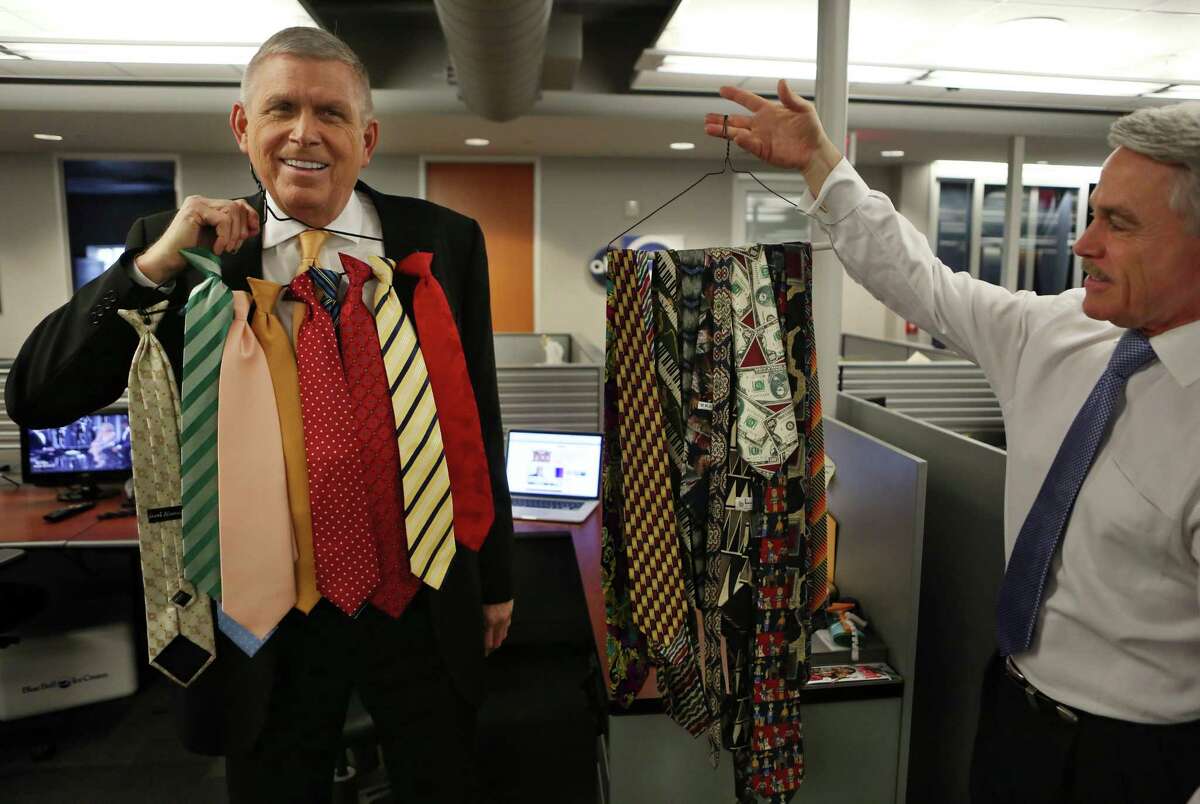 Newsmen Don Nelson, left, and Tom Koch display some of the ties they've worn during newscasts on Channel 13.﻿
