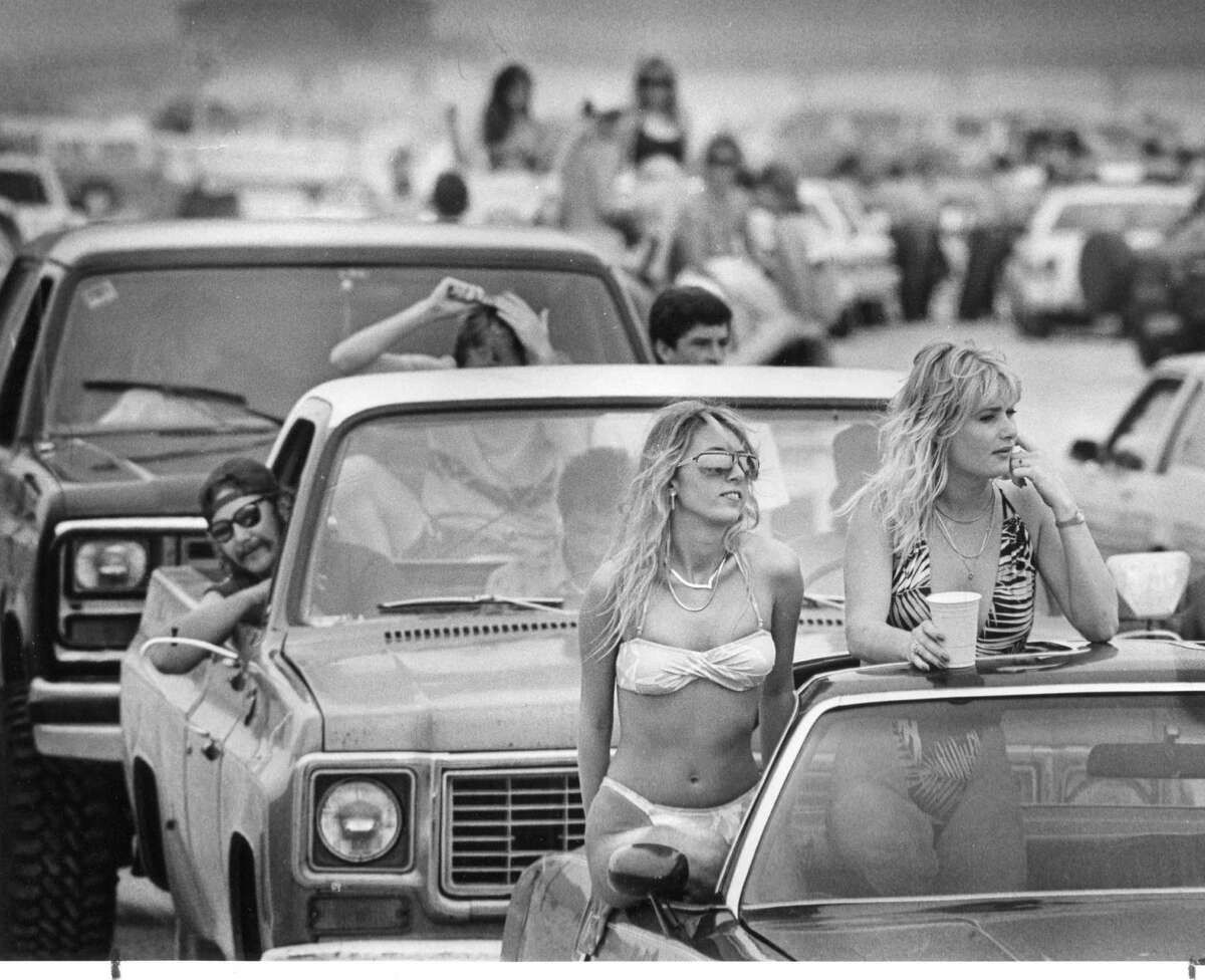 It's spring break 1988, and Chris Vitale and Dina Boyle, both of San Antonio, check out the crowd on Mustang Island.