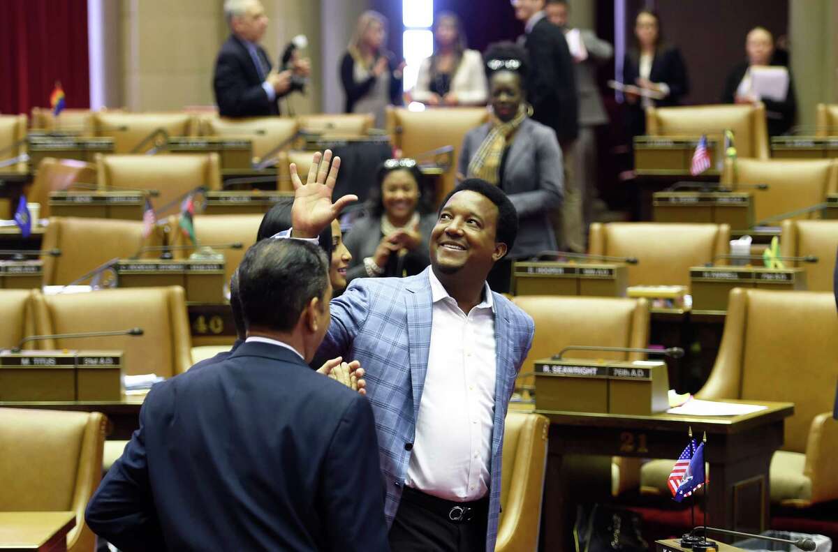 Baseball great Pedro Martinez waves to fans as he walks through the Assembly Chamber Thursday afternoon, Feb. 26, 2015, in Albany, N.Y. Martinez will be inducted in to the Baseball Hall of Fame this summer. (Skip Dickstein/Times Union)