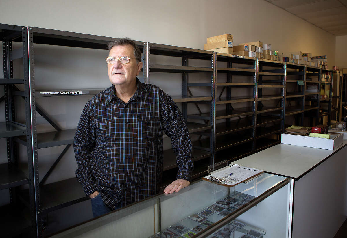 Larry Dluhy stands in his store Sports Collectibles of Houston, Thursday, Feb. 26, 2015, in Houston. The store is the oldest trading card store in Houston and going out of business this weekend.