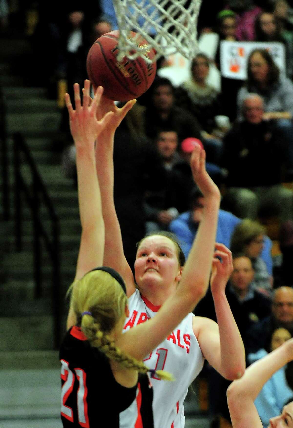 Greenwich's Abbie Wolf looks for two as Ridgefield's Rebecca Lawrence defends, during FCIAC Girls' Basketball Championship action in Fairfield, Conn. on Thursday Feb. 26, 2015.
