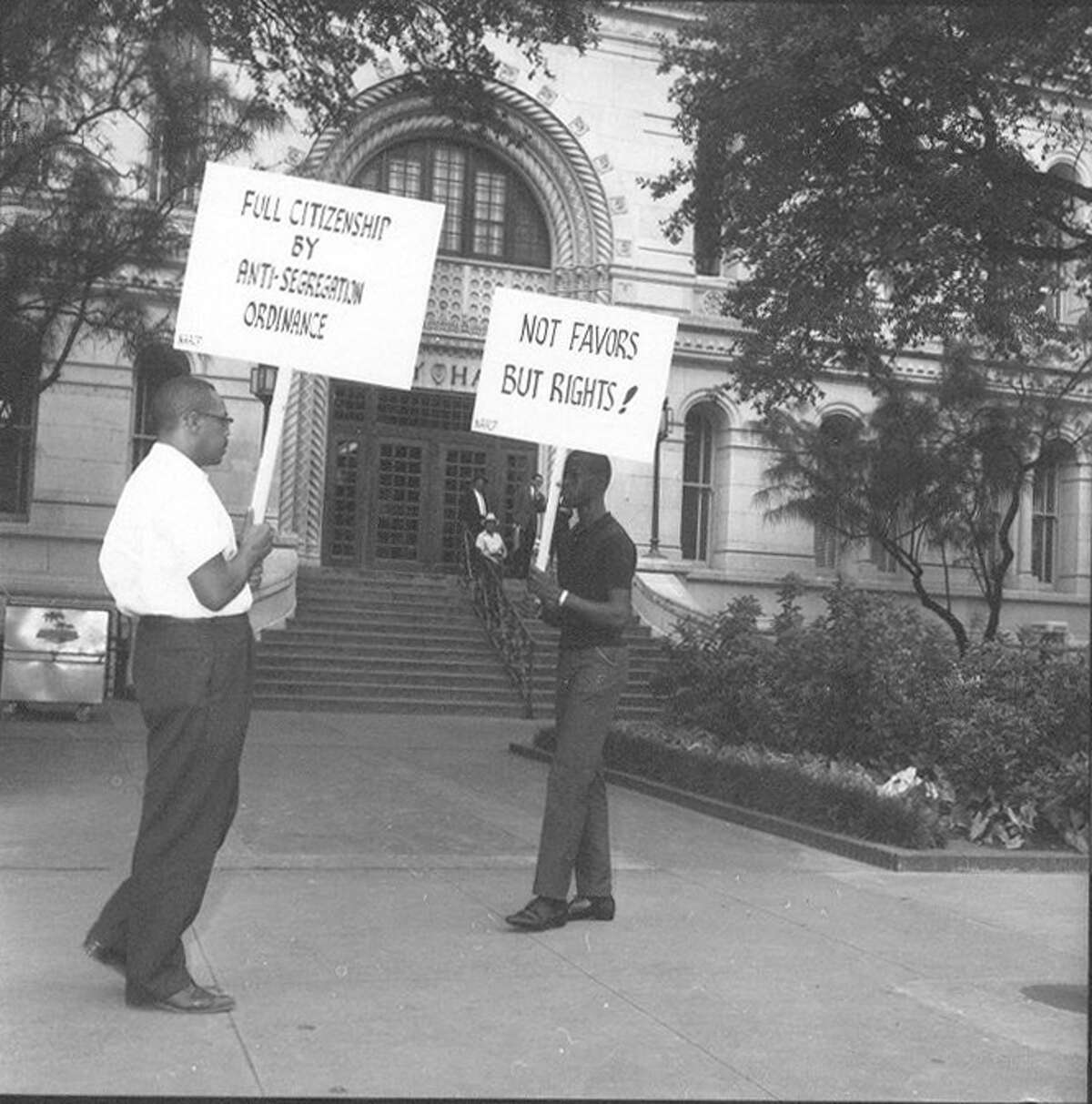 Harry V. Burns (left) and another man protest segregation at City Hall on June 12, 1963.