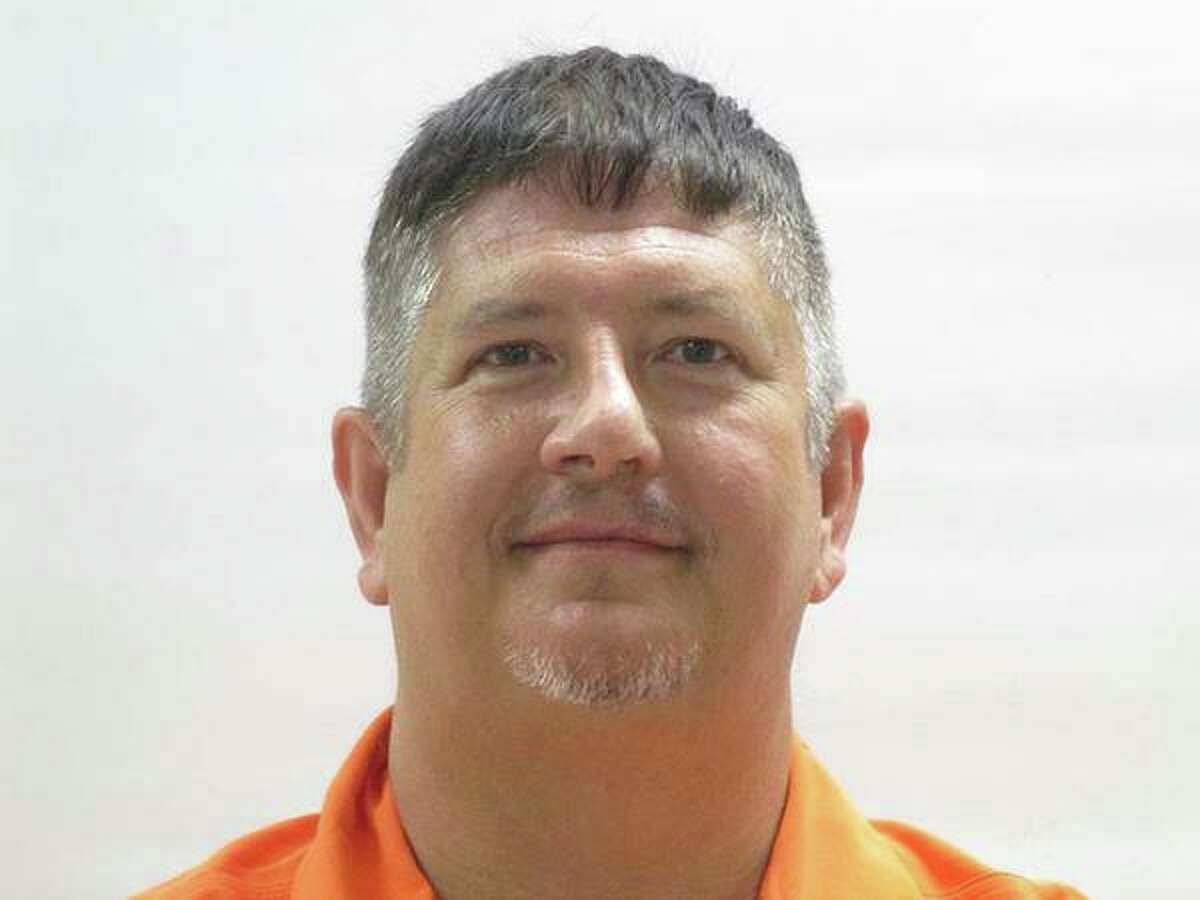 John Chambers, Indian Lake Police Department chief, is charged with 14 counts of tampering with governmental records, according to a news release from the Cameron County District Attorney's Office. The police chief was previously indicted on felony charges in August after he allegedly traveled outside of his jurisdiction to retrieve a truck for his wife's security company when a fired employee failed to return it, KGBT reported.   Pictured, Chambers in custody after the August indictment.